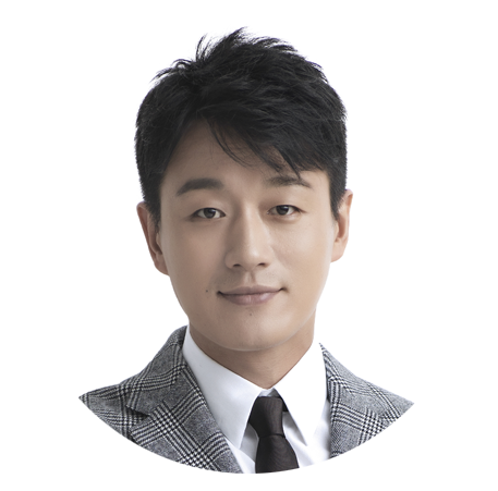 A photo of Dawei Tong, a famous Chinese actor. He is wearing a grey suit with a black tie and is against a white background.